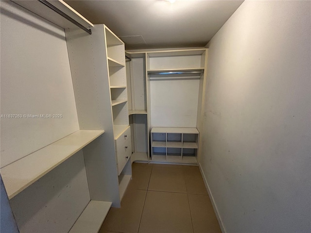 31 SE 6th St Unit 407, Miami, FL 33131 - walk in closet featuring tile patterned flooring