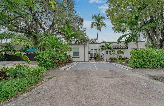 2301 SW 17th Ave, Miami, FL 33145 - view of front of house featuring stucco siding and uncovered parking
