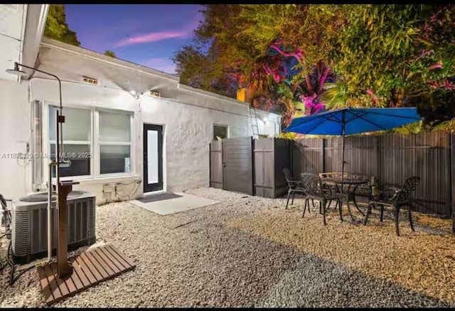 2301 SW 17th Ave, Miami, FL 33145 - patio terrace at dusk featuring a fenced backyard
