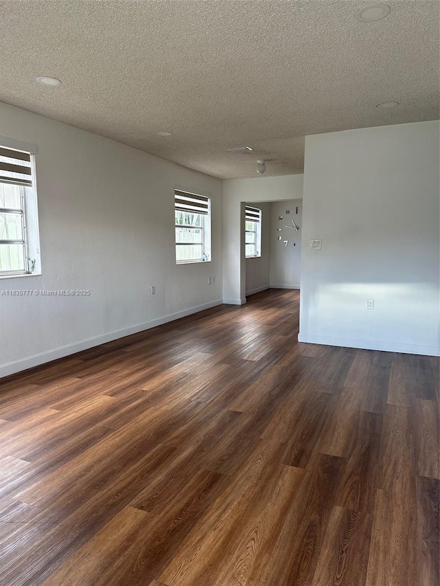 6547 SW 35th St, Miami, FL 33155 - unfurnished room with a textured ceiling and dark wood finished floors