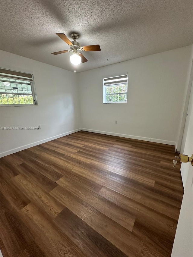6547 SW 35th St, Miami, FL 33155 - spare room with healthy amount of natural light, dark wood finished floors, a textured ceiling, and ceiling fan