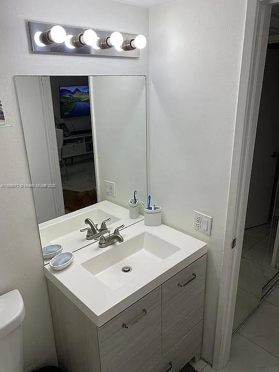 800 N Miami Ave Unit E-707, Miami, FL 33136 - half bath with vanity and toilet
