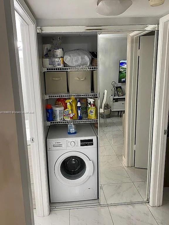 800 N Miami Ave Unit E-707, Miami, FL 33136 - washroom with washer / dryer and marble finish floors