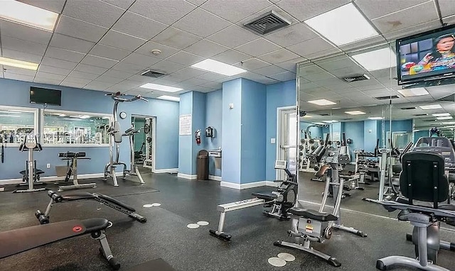 800 N Miami Ave Unit E-707, Miami, FL 33136 - exercise room featuring baseboards and a paneled ceiling