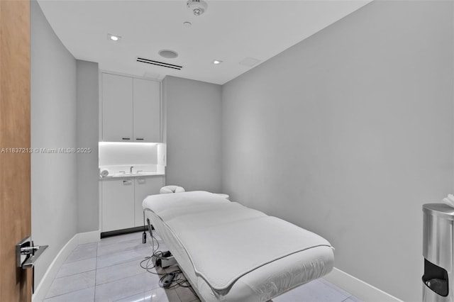 1643 Brickell Ave Unit 1406, Miami, FL 33129 - bedroom with light tile patterned floors and recessed lighting