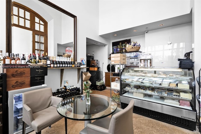 1643 Brickell Ave Unit 1406, Miami, FL 33129 - dining area with a dry bar and a high ceiling