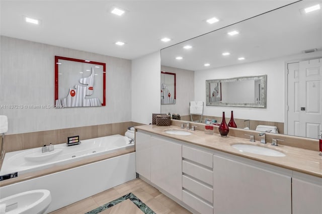 1643 Brickell Ave Unit 1406, Miami, FL 33129 - bathroom featuring a whirlpool tub, tile patterned floors, recessed lighting, double vanity, and a bidet