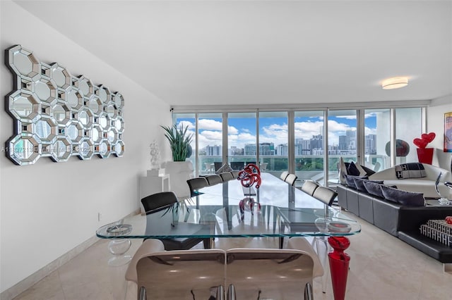 1643 Brickell Ave Unit 1406, Miami, FL 33129 - dining space featuring a skyline view and tile patterned floors