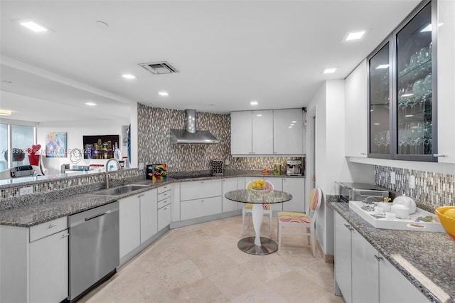 1643 Brickell Ave Unit 1406, Miami, FL 33129 - kitchen with dishwasher, wall chimney range hood, decorative backsplash, white cabinets, and recessed lighting