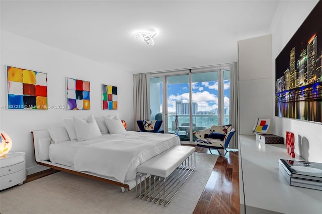 1643 Brickell Ave Unit 1406, Miami, FL 33129 - bedroom with wood finished floors and access to exterior