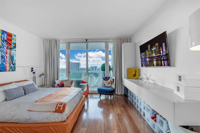 1643 Brickell Ave Unit 1406, Miami, FL 33129 - bedroom featuring access to exterior and wood finished floors