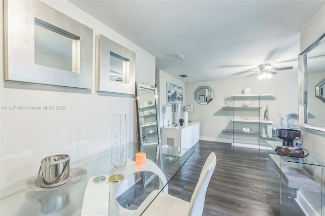 3201 NW 4th Ter Unit 80, Pompano Beach, FL 33064 - dining area featuring ceiling fan and dark wood-style floors