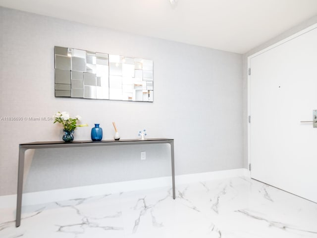 300 Sunny Isles Blvd Unit 5-1605, Sunny Isles Beach, FL 33160 - unfurnished bedroom featuring marble finish flooring and baseboards