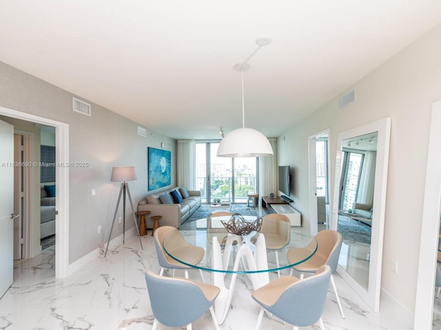 300 Sunny Isles Blvd Unit 5-1605, Sunny Isles Beach, FL 33160 - dining space featuring marble finish flooring and baseboards