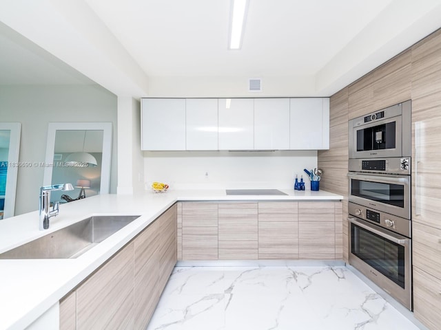 300 Sunny Isles Blvd Unit 5-1605, Sunny Isles Beach, FL 33160 - kitchen with modern cabinets and light countertops