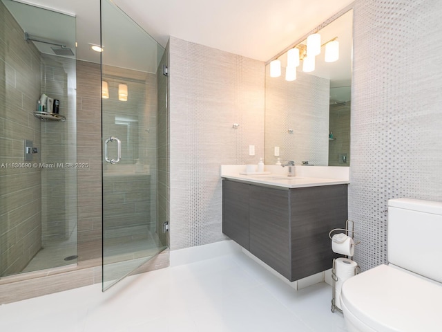 300 Sunny Isles Blvd Unit 5-1605, Sunny Isles Beach, FL 33160 - bathroom featuring a stall shower, double vanity, tile patterned flooring, and tile walls