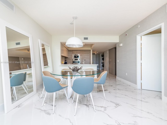 300 Sunny Isles Blvd Unit 5-1605, Sunny Isles Beach, FL 33160 - dining room featuring light marble finish floors and baseboards
