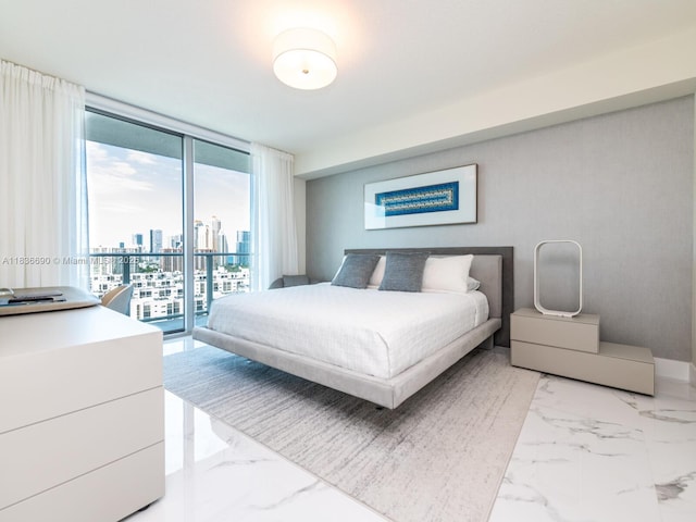 300 Sunny Isles Blvd Unit 5-1605, Sunny Isles Beach, FL 33160 - bedroom featuring floor to ceiling windows, access to outside, multiple windows, a skyline view, and light marble finish flooring
