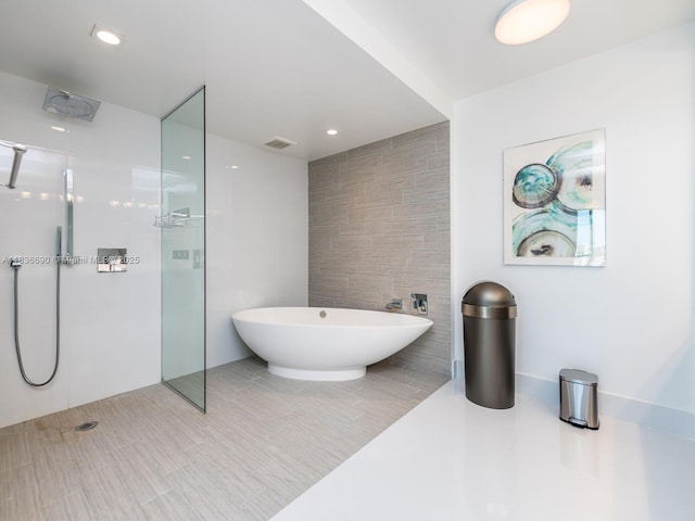300 Sunny Isles Blvd Unit 5-1605, Sunny Isles Beach, FL 33160 - bathroom with tile walls, a soaking tub, and a walk in shower