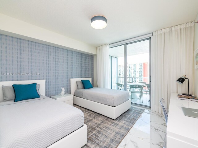 300 Sunny Isles Blvd Unit 5-1605, Sunny Isles Beach, FL 33160 - bedroom featuring access to exterior and light marble finish flooring