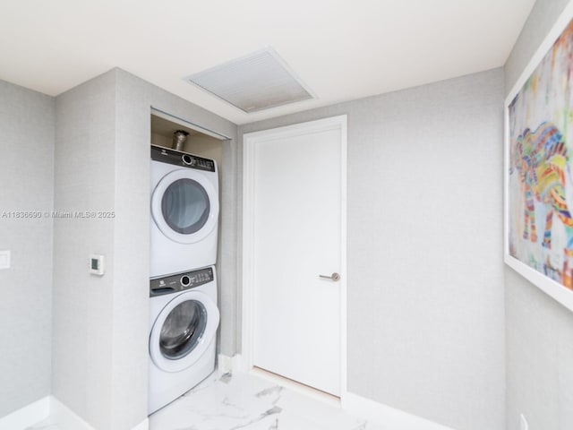 300 Sunny Isles Blvd Unit 5-1605, Sunny Isles Beach, FL 33160 - washroom featuring stacked washer / drying machine, marble look tile flooring, and attic access