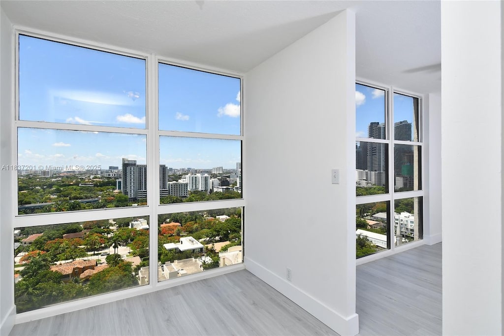 1901 Brickell Ave Unit B2209, Miami, FL 33129 - unfurnished sunroom featuring a city view and healthy amount of natural light