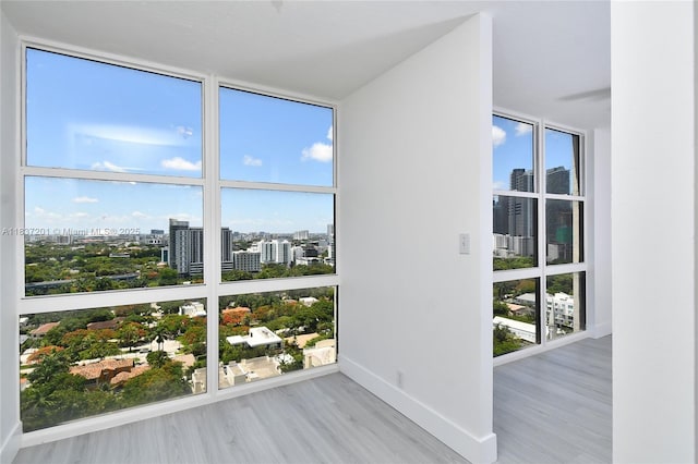 1901 Brickell Ave Unit B2209, Miami, FL 33129 - unfurnished sunroom featuring a city view and healthy amount of natural light