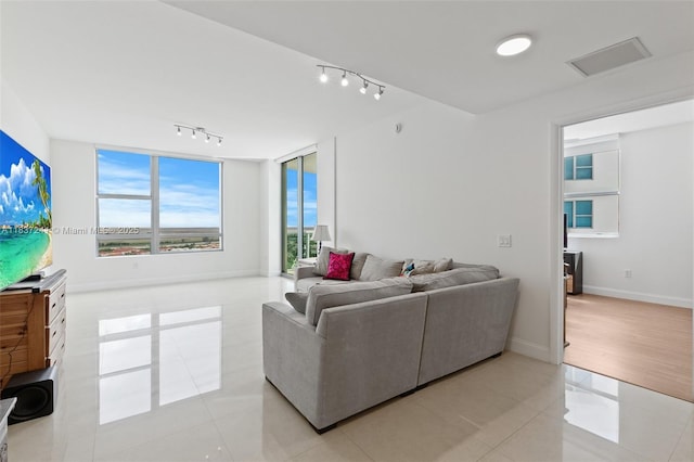 2681 N Flamingo Rd Unit 2508S, Sunrise, FL 33323 - living room with rail lighting and light tile patterned flooring