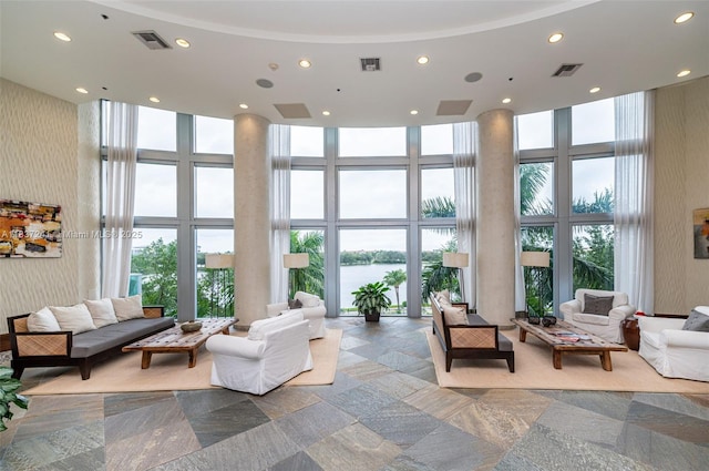2681 N Flamingo Rd Unit 2508S, Sunrise, FL 33323 - lobby with a high ceiling, a wall of windows, recessed lighting, and a water view