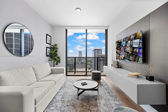 398 NE 5th St Unit 3219, Miami, FL 33132 - living area with a wall of windows and wood finished floors