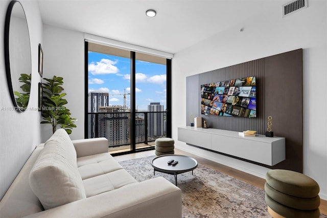 398 NE 5th St Unit 3219, Miami, FL 33132 - living room with a wall of windows and wood finished floors