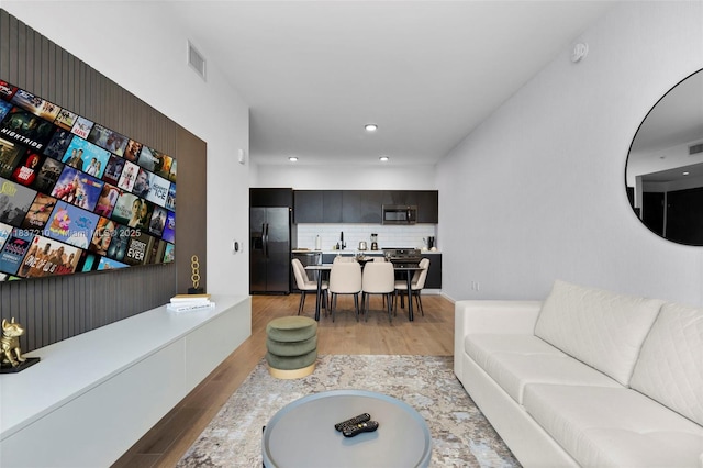 398 NE 5th St Unit 3219, Miami, FL 33132 - living room featuring light wood finished floors and recessed lighting