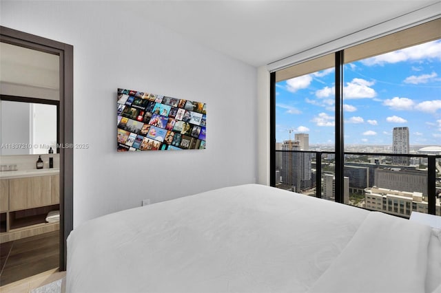 398 NE 5th St Unit 3219, Miami, FL 33132 - bedroom with expansive windows, a view of city, and wood finished floors