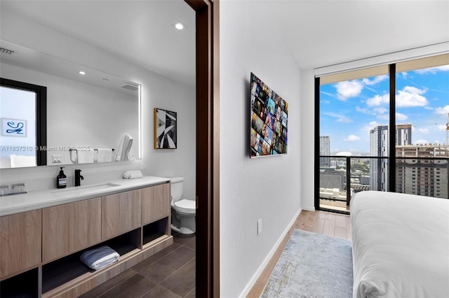 398 NE 5th St Unit 3219, Miami, FL 33132 - bedroom featuring a wall of windows, a view of city, and recessed lighting