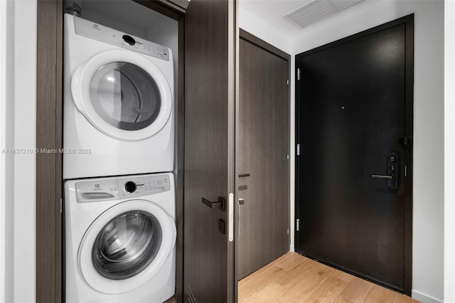 398 NE 5th St Unit 3219, Miami, FL 33132 - laundry area featuring stacked washer / dryer and light wood finished floors