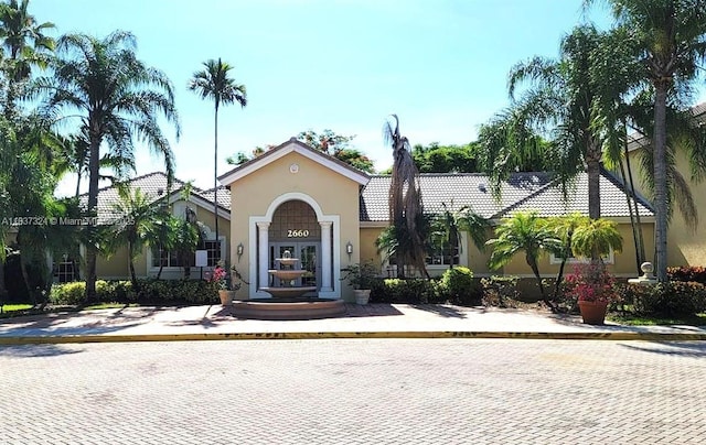 2600 S University Dr Unit 307, Davie, FL 33328 - mediterranean / spanish-style house featuring stucco siding and a tile roof