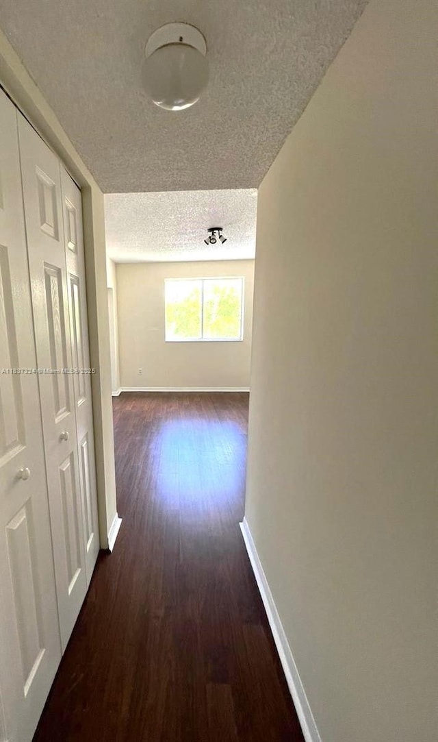 2600 S University Dr Unit 307, Davie, FL 33328 - corridor with a textured ceiling and dark wood-type flooring