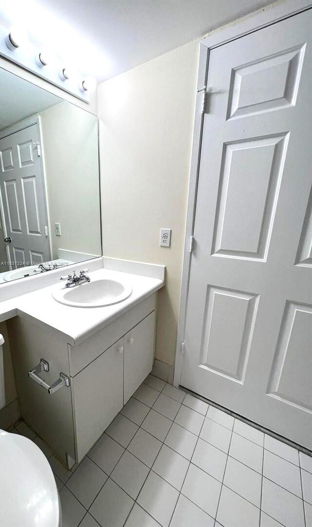2600 S University Dr Unit 307, Davie, FL 33328 - half bathroom featuring vanity and tile patterned flooring