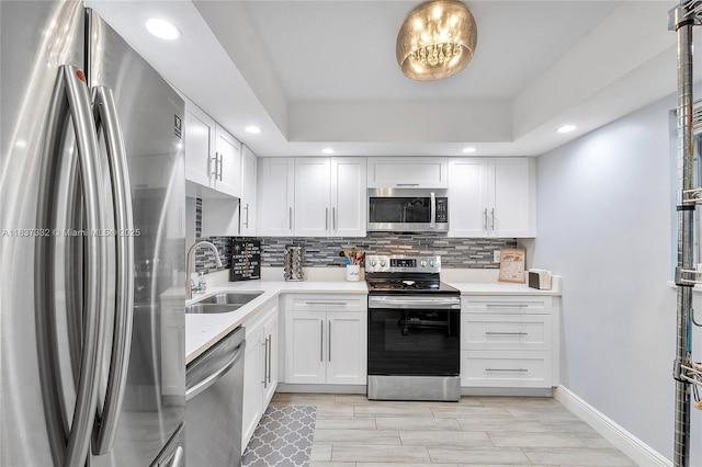 8821 NW 38th Dr Unit 103A, Coral Springs, FL 33065 - kitchen with stainless steel appliances, light countertops, tasteful backsplash, and recessed lighting