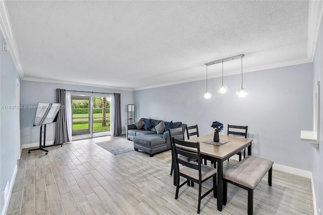 8821 NW 38th Dr Unit 103A, Coral Springs, FL 33065 - dining area featuring a textured ceiling, light wood finished floors, and crown molding