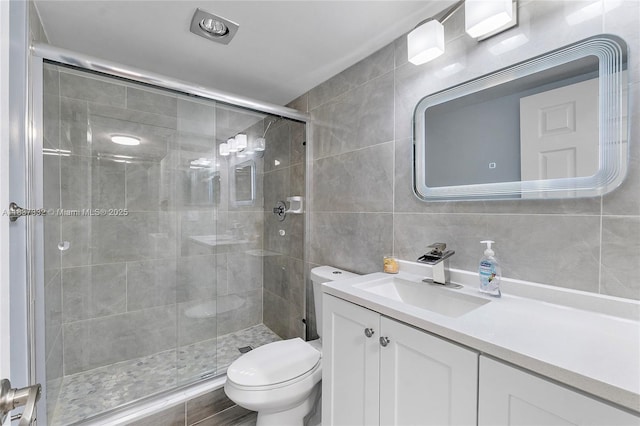 8821 NW 38th Dr Unit 103A, Coral Springs, FL 33065 - full bathroom featuring tile walls, vanity, a shower stall, and tasteful backsplash