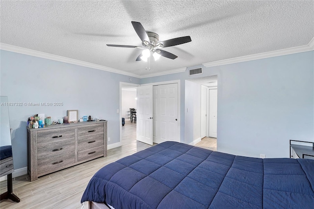 8821 NW 38th Dr Unit 103A, Coral Springs, FL 33065 - bedroom with light wood-style floors, crown molding, a textured ceiling, and ceiling fan