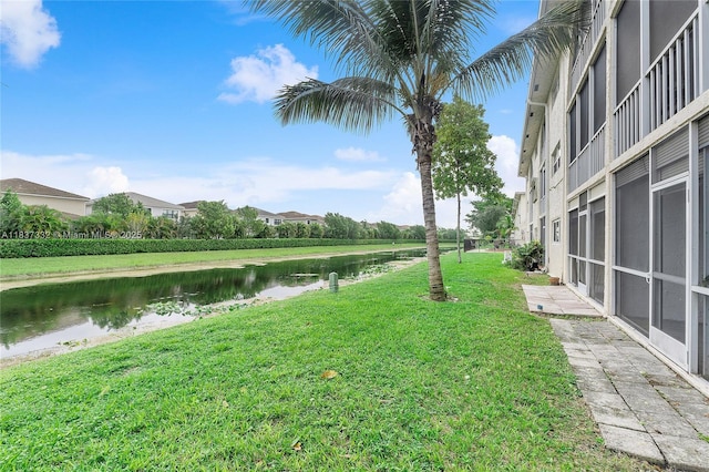 8821 NW 38th Dr Unit 103A, Coral Springs, FL 33065 - view of grassy yard with a water view