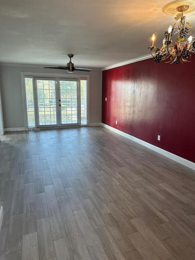 661 N University Dr Unit 1-201, Pembroke Pines, FL 33024 - unfurnished room featuring a chandelier, crown molding, wood finished floors, and ceiling fan
