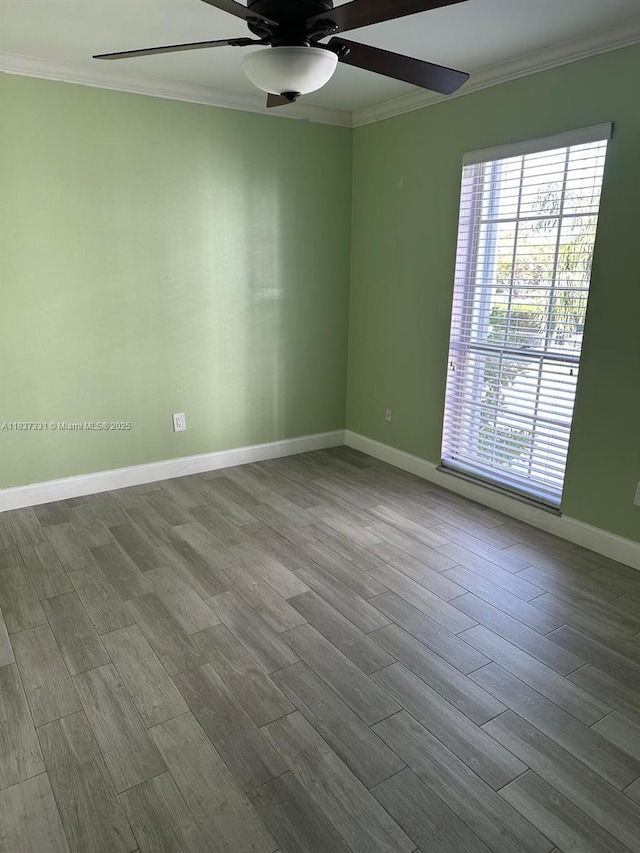 661 N University Dr Unit 1-201, Pembroke Pines, FL 33024 - spare room featuring crown molding, ceiling fan, and dark wood-type flooring