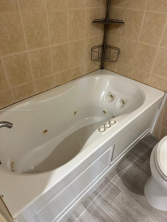661 N University Dr Unit 1-201, Pembroke Pines, FL 33024 - full bathroom featuring a whirlpool tub and tile walls