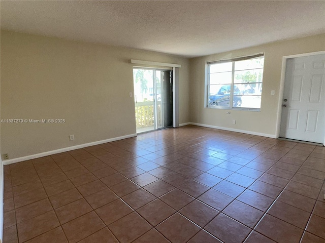 1720 Funston St Unit 111, Hollywood, FL 33020 - empty room with tile patterned flooring and a textured ceiling