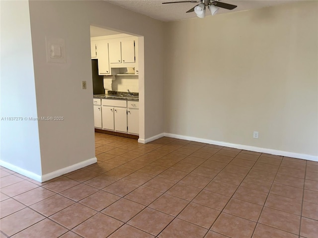 1720 Funston St Unit 111, Hollywood, FL 33020 - spare room featuring ceiling fan, light tile patterned floors, and a textured ceiling