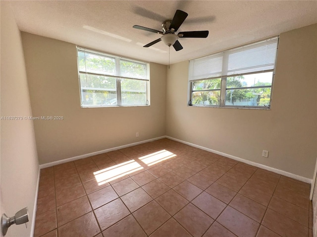 1720 Funston St Unit 111, Hollywood, FL 33020 - tiled empty room featuring plenty of natural light, a ceiling fan, and a textured ceiling