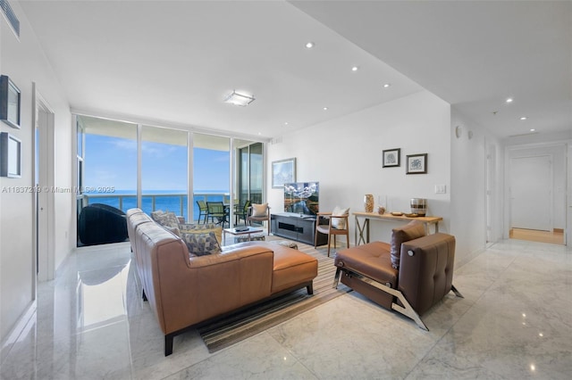 18201 Collins Ave Unit 1006, Sunny Isles Beach, FL 33160 - living area featuring expansive windows, recessed lighting, and light marble finish flooring